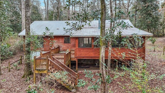 220 Deer Pass, Havana, FL 32333 - back of property with stairway, a deck, and log siding