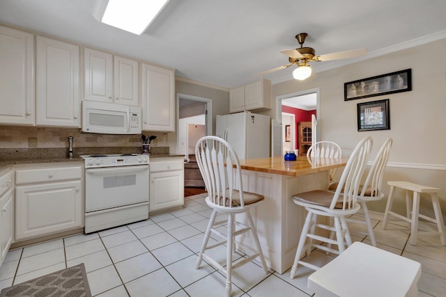 kitchen featuring white appliances, wooden counters, white cabinets, ceiling fan, and ornamental molding