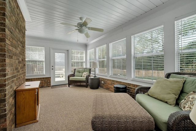 sunroom / solarium featuring ceiling fan