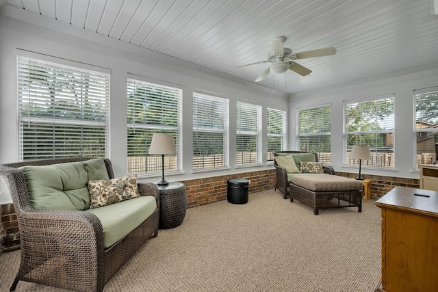 sunroom / solarium with ceiling fan and wood ceiling