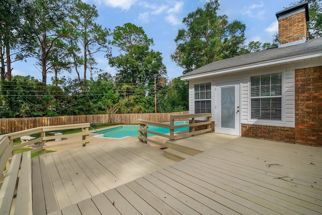 deck with a fenced in pool