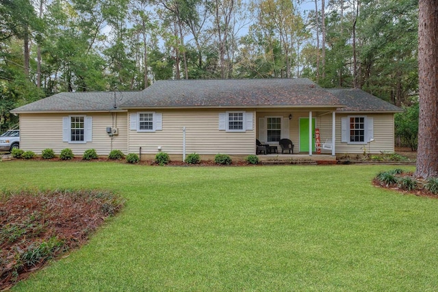 single story home featuring covered porch and a front lawn