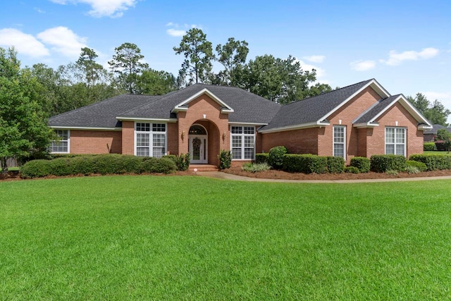 ranch-style home with a front yard