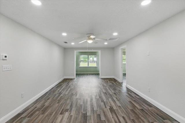 1822 N US-221, Perry, FL 32347 - unfurnished room with recessed lighting, baseboards, dark wood-style floors, and a ceiling fan