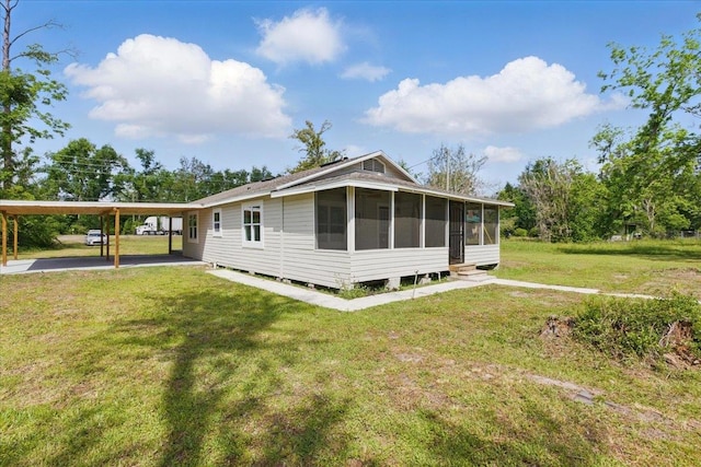 1822 N US-221, Perry, FL 32347 - exterior space with a yard, aphalt driveway, a sunroom, and a carport