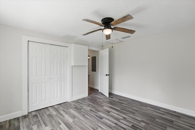 1822 N US-221, Perry, FL 32347 - unfurnished bedroom with visible vents, baseboards, wood finished floors, and electric panel