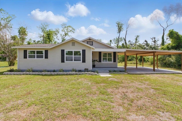 1822 N US-221, Perry, FL 32347 - view of front of house with a front yard and a carport
