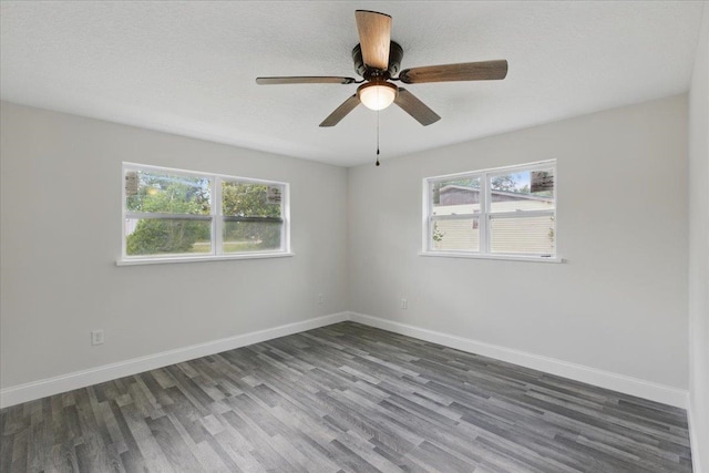 1822 N US-221, Perry, FL 32347 - empty room featuring baseboards, wood finished floors, and a healthy amount of sunlight