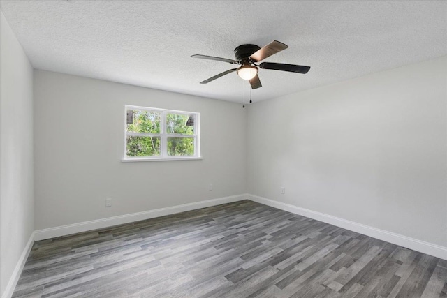 1822 N US-221, Perry, FL 32347 - spare room with baseboards, a textured ceiling, ceiling fan, and wood finished floors
