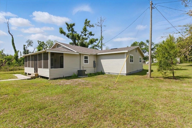 1822 N US-221, Perry, FL 32347 - rear view of house featuring cooling unit, roof with shingles, a sunroom, crawl space, and a yard