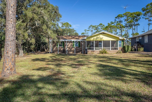 view of yard featuring a sunroom