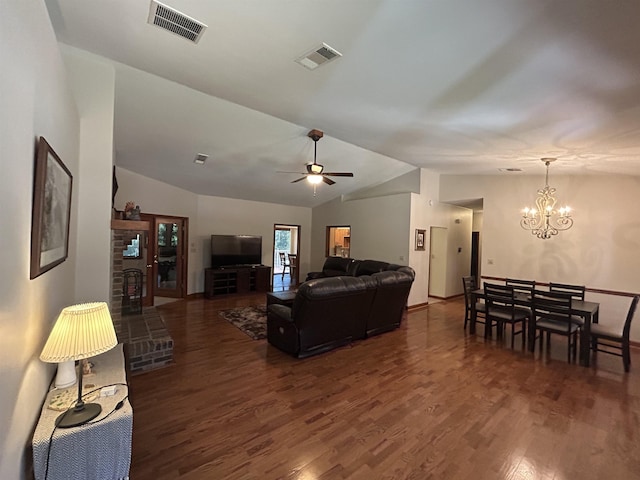 living room with lofted ceiling, dark hardwood / wood-style flooring, and ceiling fan with notable chandelier