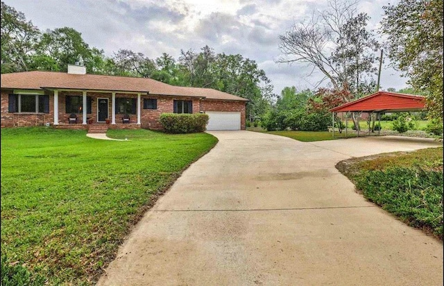 single story home featuring a garage, covered porch, a carport, and a front yard