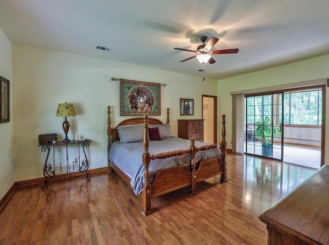 bedroom with hardwood / wood-style floors, access to exterior, and ceiling fan