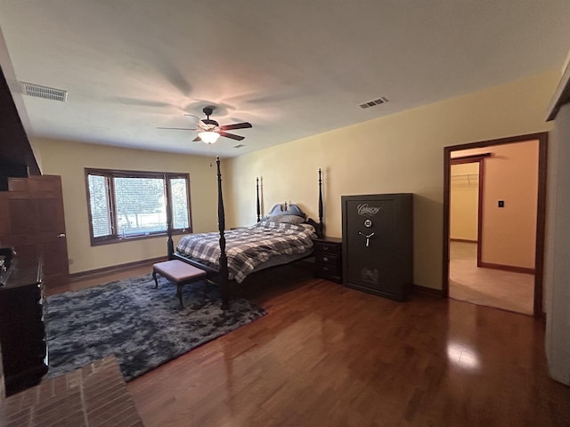 bedroom with ceiling fan and wood-type flooring