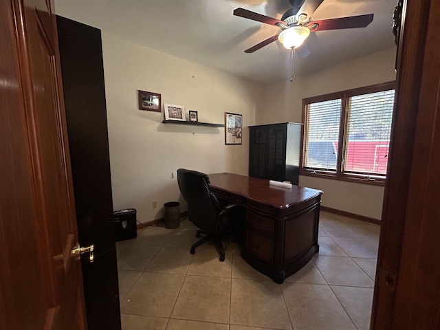 office featuring light tile patterned floors and ceiling fan