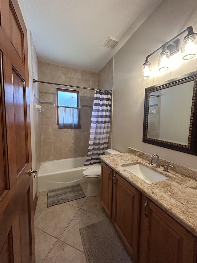 full bathroom featuring shower / tub combo with curtain, tile patterned floors, toilet, and vanity