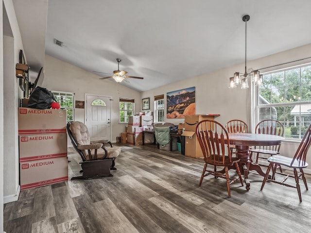 172 Mohave Rd, Crawfordville, FL 32327 - dining room with wood finished floors, healthy amount of natural light, a chandelier, and vaulted ceiling