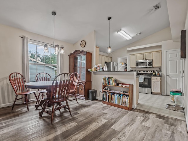 172 Mohave Rd, Crawfordville, FL 32327 - dining room featuring vaulted ceiling and light wood-style floors