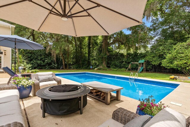 3690 Dexter Dr, Tallahassee, FL 32312 - swimming pool featuring a fire pit, a playground, and a patio area