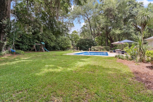 3690 Dexter Dr, Tallahassee, FL 32312 - view of green lawn featuring an outdoor pool and a playground