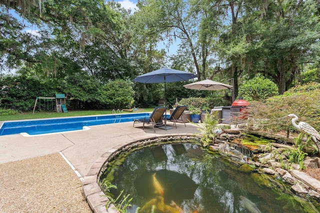 3690 Dexter Dr, Tallahassee, FL 32312 - outdoor pool featuring a patio and a playground