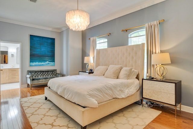 3690 Dexter Dr, Tallahassee, FL 32312 - bedroom with a chandelier, ornamental molding, wood finished floors, and ensuite bathroom