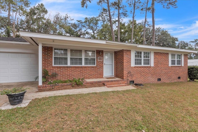 ranch-style home featuring a garage and a front lawn