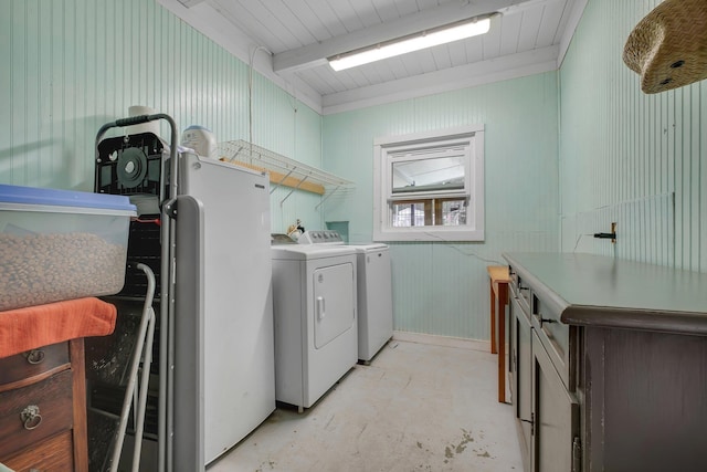 clothes washing area with washing machine and clothes dryer