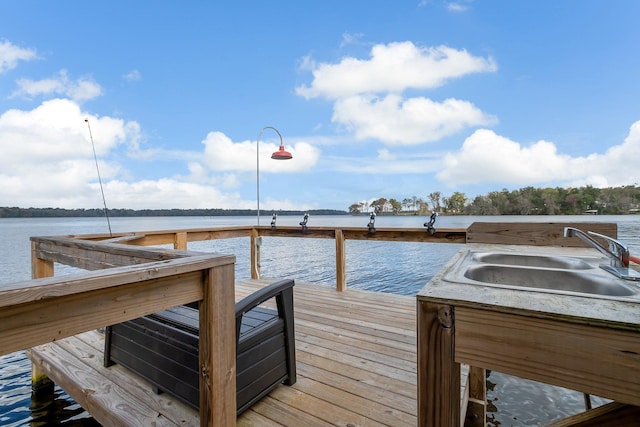 view of dock featuring a water view and sink