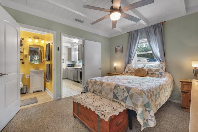 bedroom featuring sink, beam ceiling, ensuite bathroom, wooden ceiling, and light colored carpet