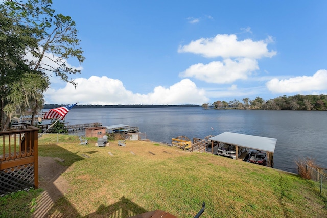 exterior space featuring a water view and a yard