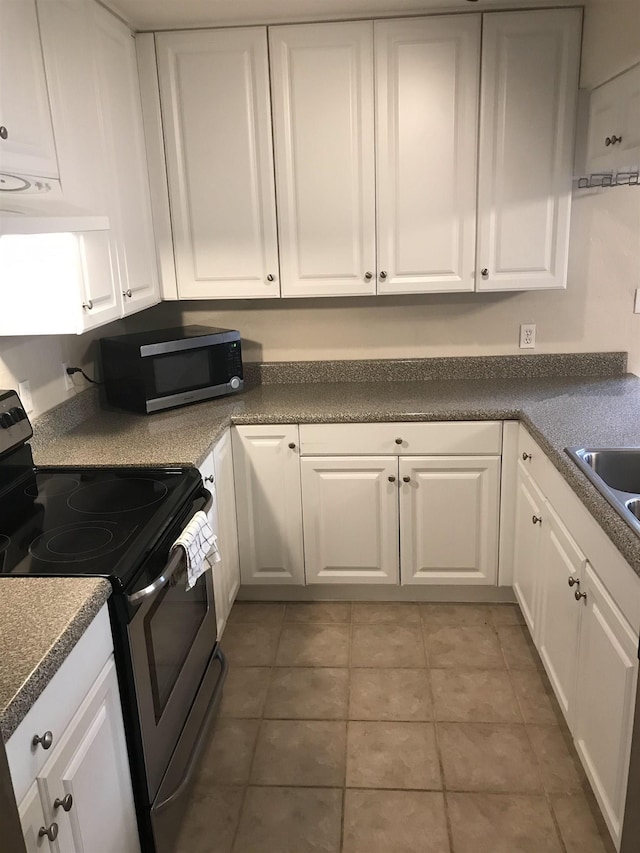 2247 Shady Timbers Cir Unit C, Tallahassee, FL 32304 - kitchen featuring appliances with stainless steel finishes, white cabinets, dark countertops, and custom range hood