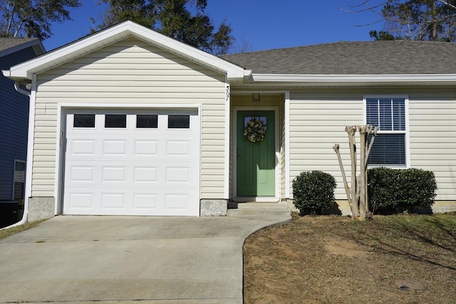 ranch-style house featuring a garage