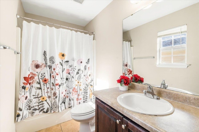 bathroom featuring tile patterned flooring, vanity, toilet, and a shower with shower curtain