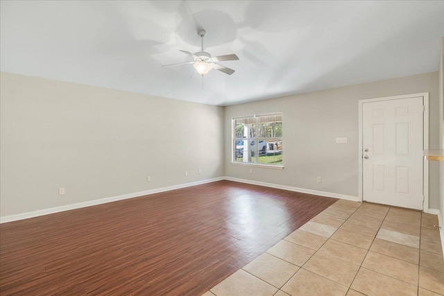 unfurnished room featuring ceiling fan and light tile patterned floors