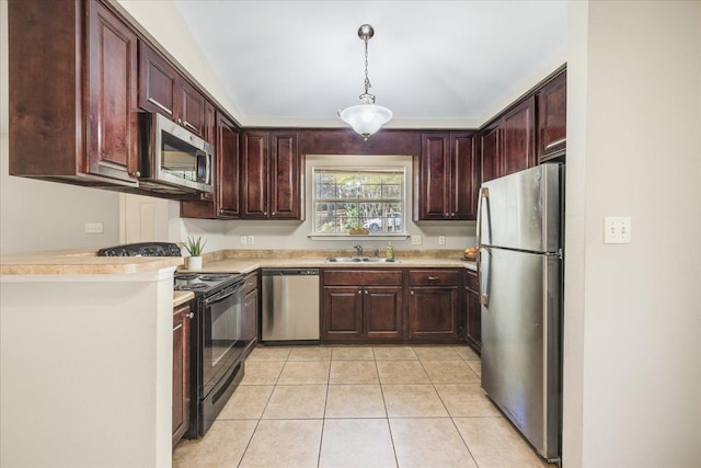 kitchen with pendant lighting, stainless steel appliances, light tile patterned floors, and sink