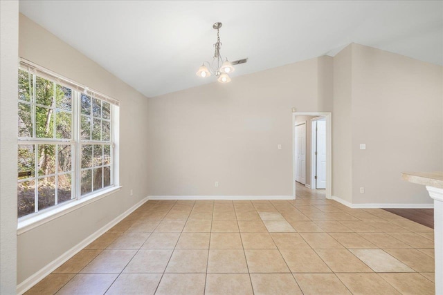 tiled spare room featuring vaulted ceiling and an inviting chandelier