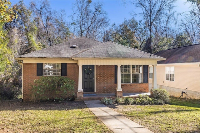 view of front of property with a porch and a front yard