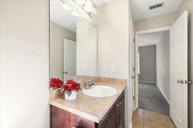 bathroom featuring tile patterned floors and vanity