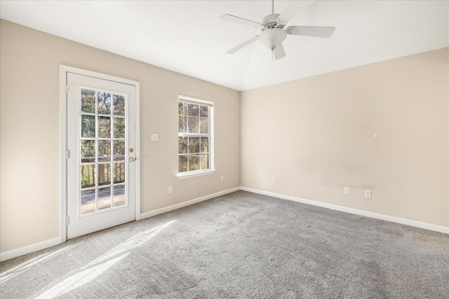 carpeted empty room with ceiling fan