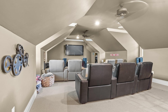 home theater room with carpet, ceiling fan, vaulted ceiling, and baseboards