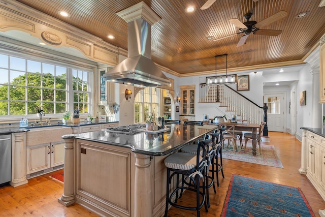 kitchen with wood ceiling, a sink, island range hood, ceiling fan, and a center island