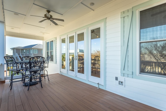 wooden deck featuring ceiling fan and french doors