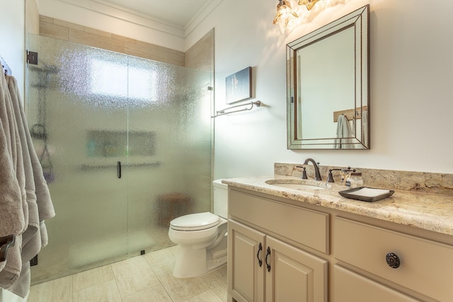 bathroom with an enclosed shower, vanity, crown molding, tile patterned flooring, and toilet