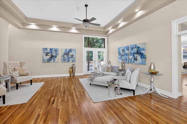 7502 Refuge Rd, Tallahassee, FL 32312 - living area with french doors, ceiling fan, a tray ceiling, wood finished floors, and crown molding