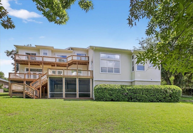 7502 Refuge Rd, Tallahassee, FL 32312 - rear view of house featuring a yard, stucco siding, stairway, and a balcony
