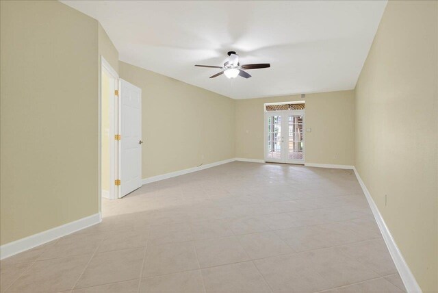 7502 Refuge Rd, Tallahassee, FL 32312 - empty room featuring a ceiling fan, french doors, and light tile patterned flooring