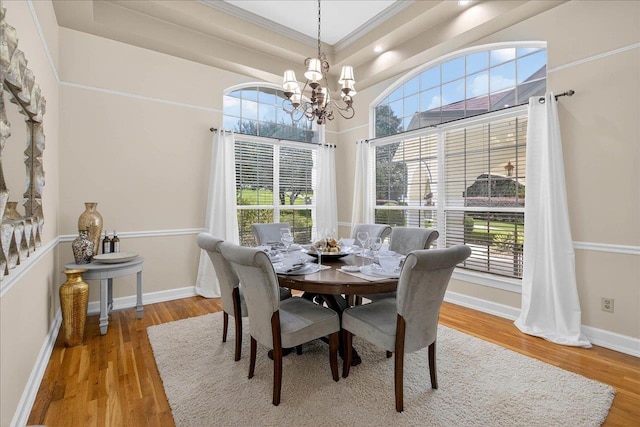 7502 Refuge Rd, Tallahassee, FL 32312 - dining area with a chandelier, crown molding, and wood finished floors