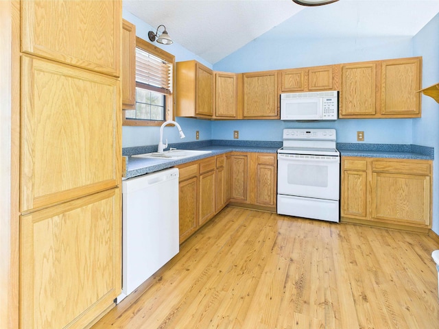18722 Key Deer Ct, Keaton Beach, FL 32348 - kitchen featuring white appliances, a sink, lofted ceiling, and light wood finished floors